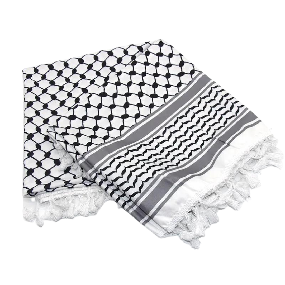 A white keffiyeh (traditional Palestinian headscarf) folded neatly on display. The scarf features a classic pattern of interwoven lines and geometric shapes, symbolizing cultural identity and resistance. The material appears soft and lightweight, perfect for both fashion and practical use. This keffiyeh is part of the "Shadow Resurgence" collection, emphasizing its modern, bold aesthetic while honoring its deep historical roots.