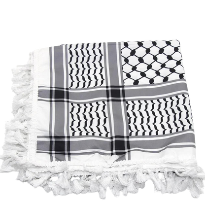 A white keffiyeh (traditional Palestinian headscarf) folded neatly on display. The scarf features a classic pattern of interwoven lines and geometric shapes, symbolizing cultural identity and resistance. The material appears soft and lightweight, perfect for both fashion and practical use. This keffiyeh is part of the "Shadow Resurgence" collection, emphasizing its modern, bold aesthetic while honoring its deep historical roots.